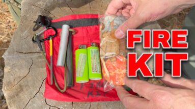 Starting a campfire with birch bark and ferro rod in the forest